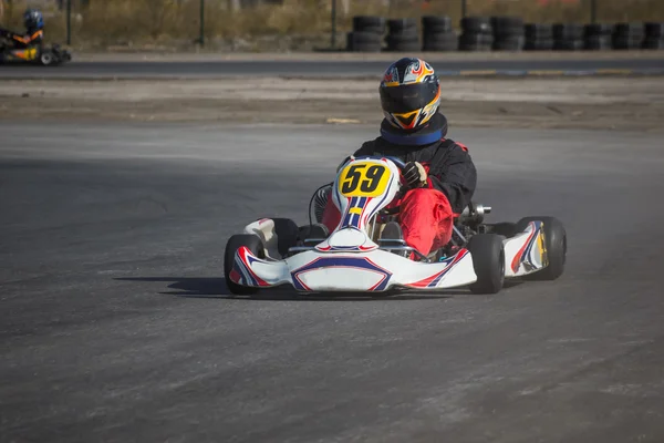 Karting - driver in helmet on kart circuit — Stock Photo, Image