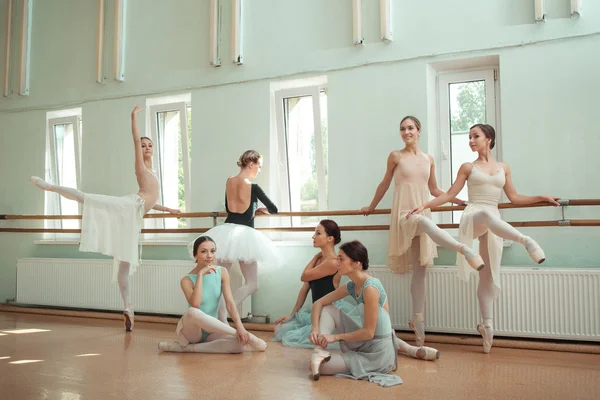 The seven ballerinas at ballet bar — Stock Photo, Image