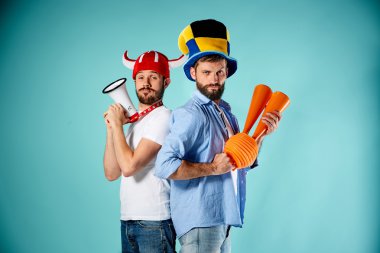 The two football fans with mouthpiece over blue clipart