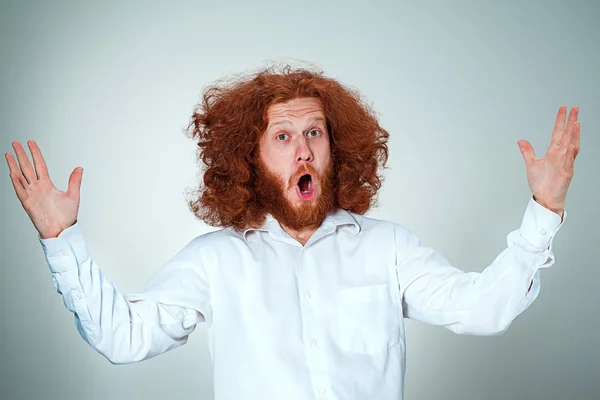 Portrait of young man with shocked facial expression — Stock Photo, Image