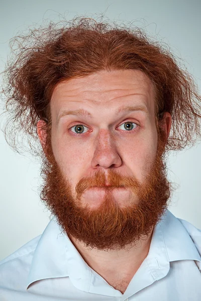 Portrait of young man with shocked facial expression — Stock Photo, Image