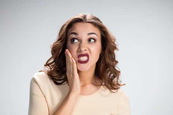 The calling for silence girl or woman on gray background — Stock Photo, Image