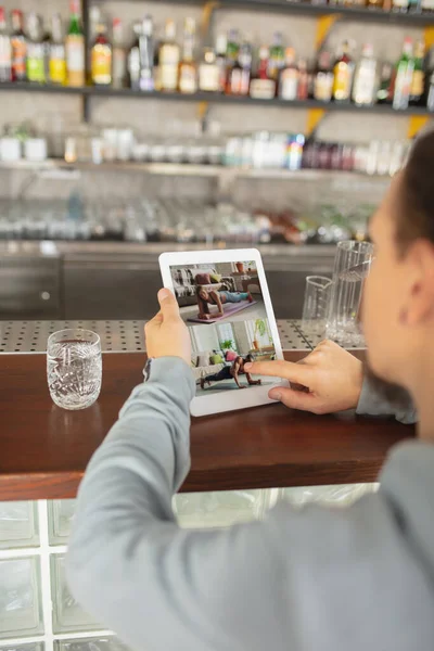 Remote working. Workplace in bar, restaurant office with PC, devices and gadgets.