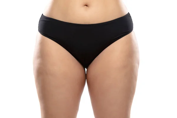 Overweight woman with fat cellulite legs and buttocks, obesity female body in black underwear isolated on white background — Stock Photo, Image
