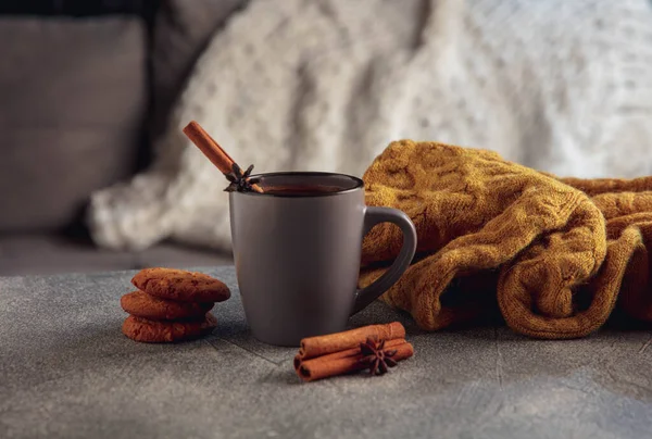 Cup of tea or coffee with cinnamon and cookies isolated on grey and white background. Copy Space for ad, design.