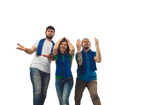 Two men and woman as soccer fans cheering for favourite sport team with bright emotions isolated on white studio background — Stock Photo, Image