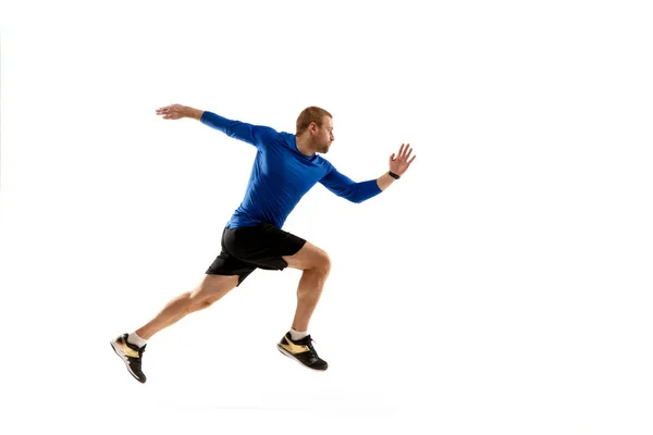 Běloch profesionální běžec, trénink jogger izolované na bílém pozadí studia v ohni — Stock fotografie