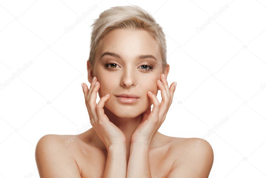Beautiful caucasian woman with heterochromia isolated on white studio background