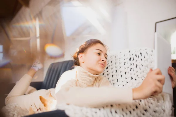 Young woman enjoying her domestic life. Home comfort, winter and holidays time — Stock Photo, Image