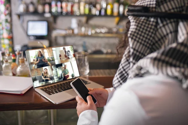 Arabian businessman working in office, business centre using devicesm gadgets. Lifestyle