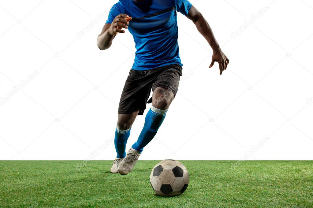 Close up legs of professional soccer, football player fighting for ball on field isolated on white background