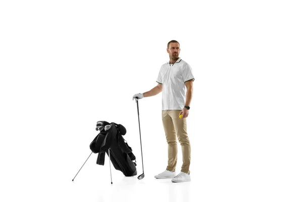 Golf player in a white shirt practicing, playing isolated on white studio background — Foto Stock