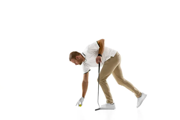 Golf player in a white shirt practicing, playing isolated on white studio background — Foto Stock