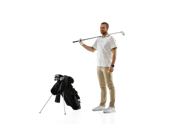 Golf player in a white shirt practicing, playing isolated on white studio background — ストック写真
