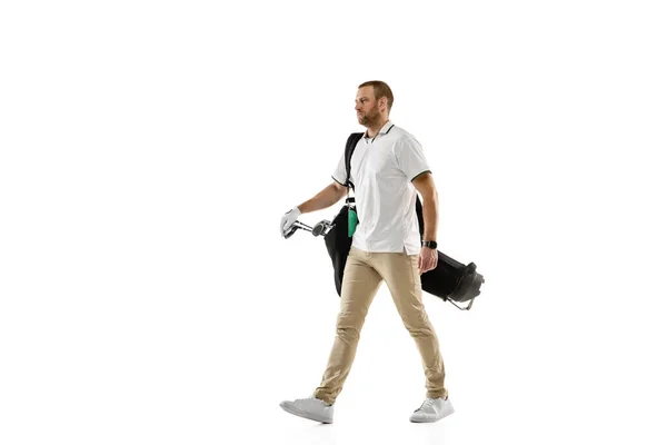 Golf player in a white shirt practicing, playing isolated on white studio background — Stock fotografie