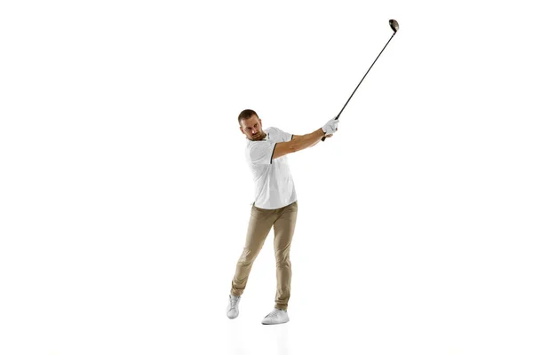 Golf speler in een wit shirt het nemen van een swing geïsoleerd op witte studio achtergrond — Stockfoto