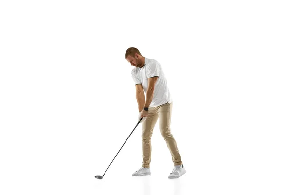 Golf player in a white shirt practicing, playing isolated on white studio background — Stock fotografie
