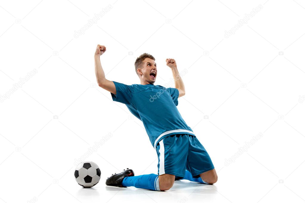 Funny emotions of professional soccer player isolated on white studio background, excitement in game