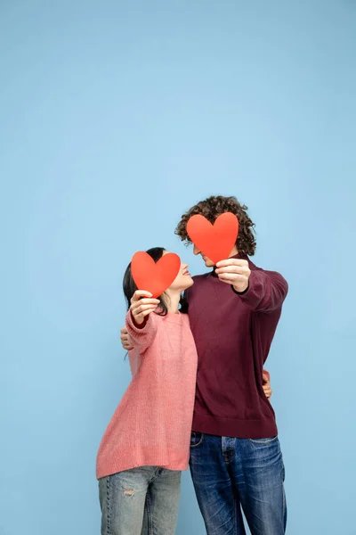 Beautiful couple in love on blue studio background. Valentines Day, love and emotions concept — Stock Photo, Image