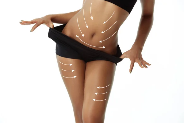 Mooi vrouwelijk lichaam met het optillen van pijlen geïsoleerd op witte achtergrond — Stockfoto