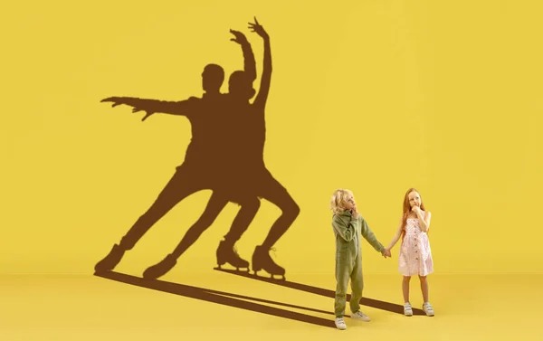 Childhood and dream about big and famous future. Conceptual image with boy and girl and shadows of fit athletes, figure skating sportsmen. — Stock Photo, Image