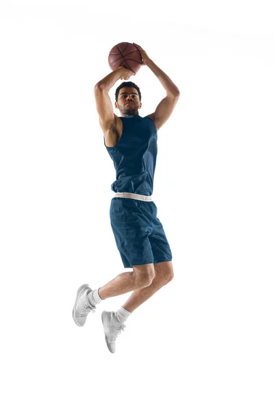 Young arabian basketball player of team in action, motion isolated on white background. Concept of sport, movement, energy and dynamic. — Stock Photo, Image