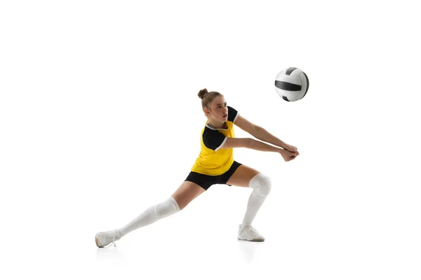 Young female volleyball player isolated on white studio background. Woman in sports equipment training and practicing. — Stock Photo, Image