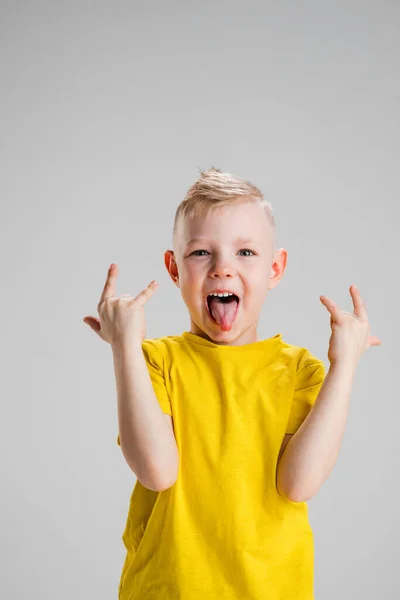 Happy boy isolated on white studio background. Looks happy, cheerful, sincere. Copyspace. Childhood, education, emotions concept — Stock Photo, Image