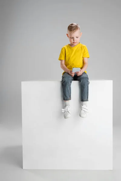 Happy boy isolated on white studio background. Looks happy, cheerful, sincere. Copyspace. Childhood, education, emotions concept — Stock Photo, Image