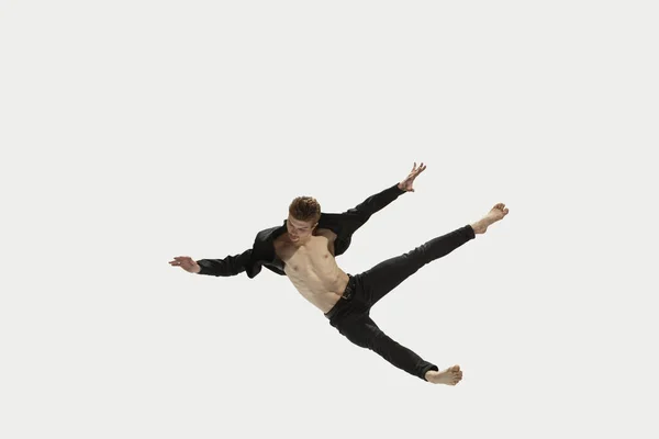 Man in casual style clothes jumping and dancing isolated on white background. Art, motion, action, flexibility, inspiration concept. Flexible caucasian ballet dancer. — Stock Photo, Image