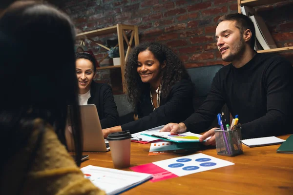 Colleagues working together in modern office using devices and gadgets during creative meeting — Stock Photo, Image