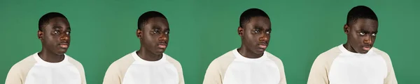 Az érzelmek fejlődése, afrikai man portré elszigetelt zöld stúdió háttér copyspace — Stock Fotó