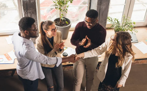 Colleagues working together in modern office using devices and gadgets during negotiations — Stock Photo, Image