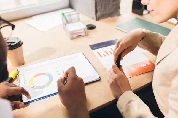 Colleagues working together in modern office using devices and gadgets during negotiations — Stock Photo, Image