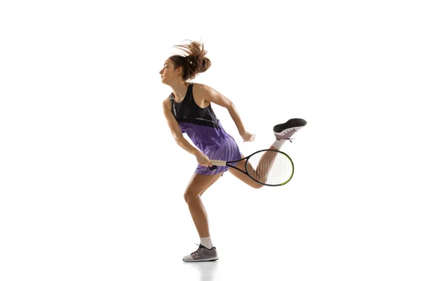 Young caucasian woman playing tennis isolated on white studio background in action and motion, sport concept — Stock Photo, Image