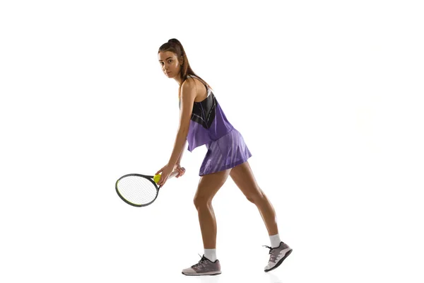 Young caucasian woman playing tennis isolated on white studio background in action and motion, sport concept — Stock Photo, Image