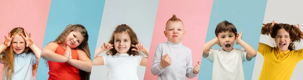 Colagem de arte feita de retratos de crianças pequenas e felizes isoladas em fundo estúdio multicolorido. Emoções humanas, conceito de expressão facial — Fotografia de Stock