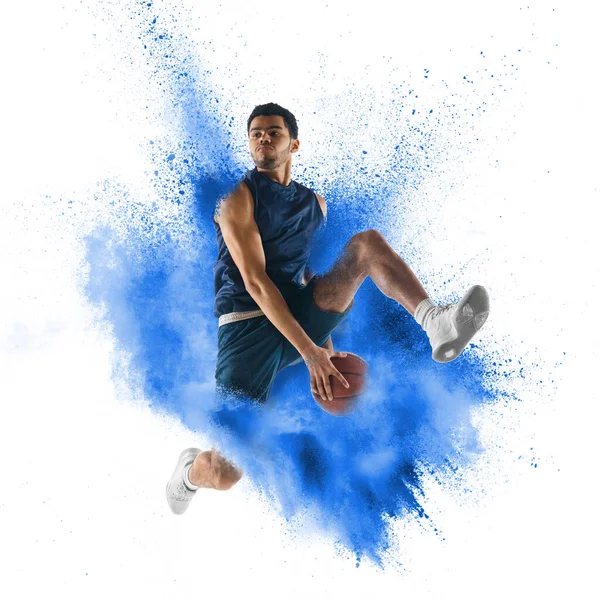 One young sportsman basketball player in explosion of colored neon powder isolated on white background — 스톡 사진