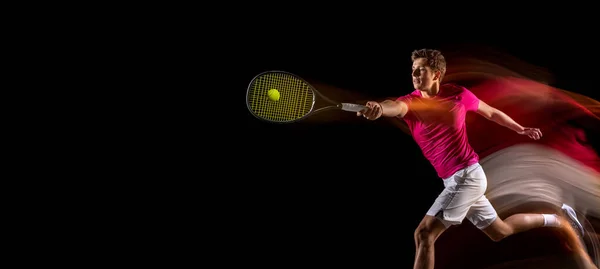 One man, male tennis player training isolated in mixed neon light on dark background. Concept of sport, team competition. — Fotografia de Stock