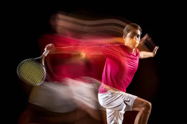 One man, male tennis player training isolated in mixed neon light on dark background. Concept of sport, team competition. — 스톡 사진