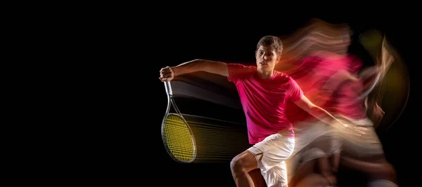 One man, male tennis player training isolated in mixed neon light on dark background. Concept of sport, team competition. — Foto de Stock