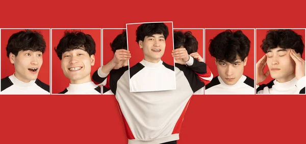 Joven chico asiático sosteniendo retratos con diferentes emociones, expresión facial aislada sobre fondo rojo. —  Fotos de Stock