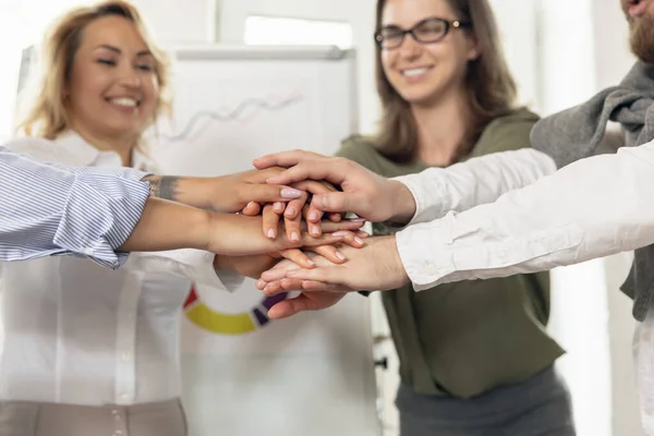 Young man and women, colleagues working together in modern office using devices and gadgets during negotiations — Stock Photo, Image