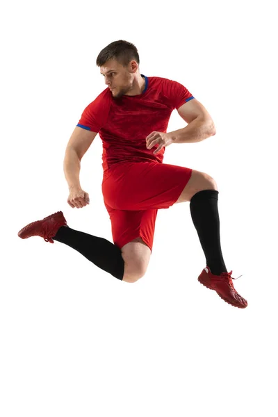 Poderoso, voando acima do campo. Jovem futebol, jogador de futebol em ação, movimento isolado em fundo branco . — Fotografia de Stock