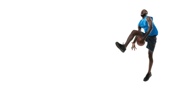 Full length portrait of a basketball player with a ball isolated on white studio background. advertising concept. Fit african american athlete jumping with ball. — Stock Photo, Image