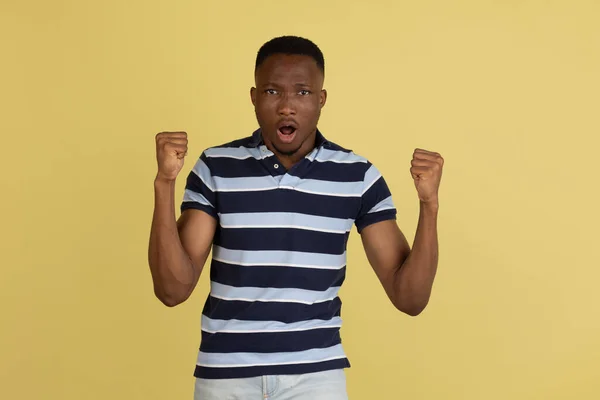 I won. Winning success happy man celebrating being a winner. Dynamic image of afro male model on pink studio background. — Foto Stock