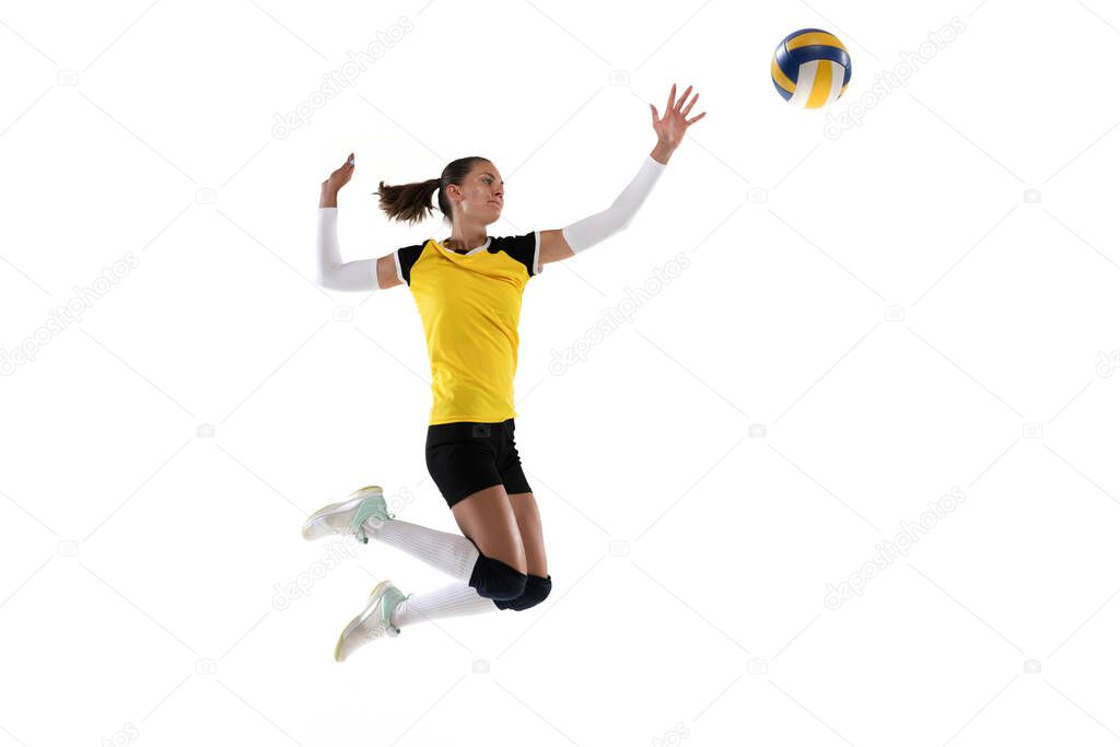 Female professional volleyball player with ball isolated on white studio background. The athlete, exercise, action, sport, healthy lifestyle, training, fitness concept.