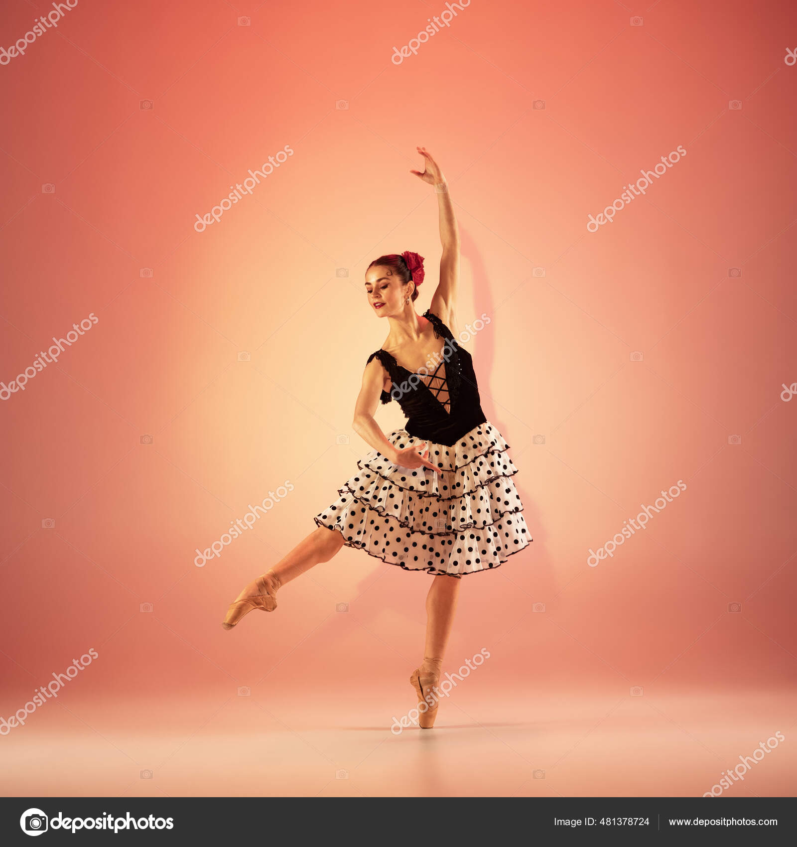 and incredibly ballerina is posing and dancing at red studio full of light. Stock Photo by ©vova130555@gmail.com