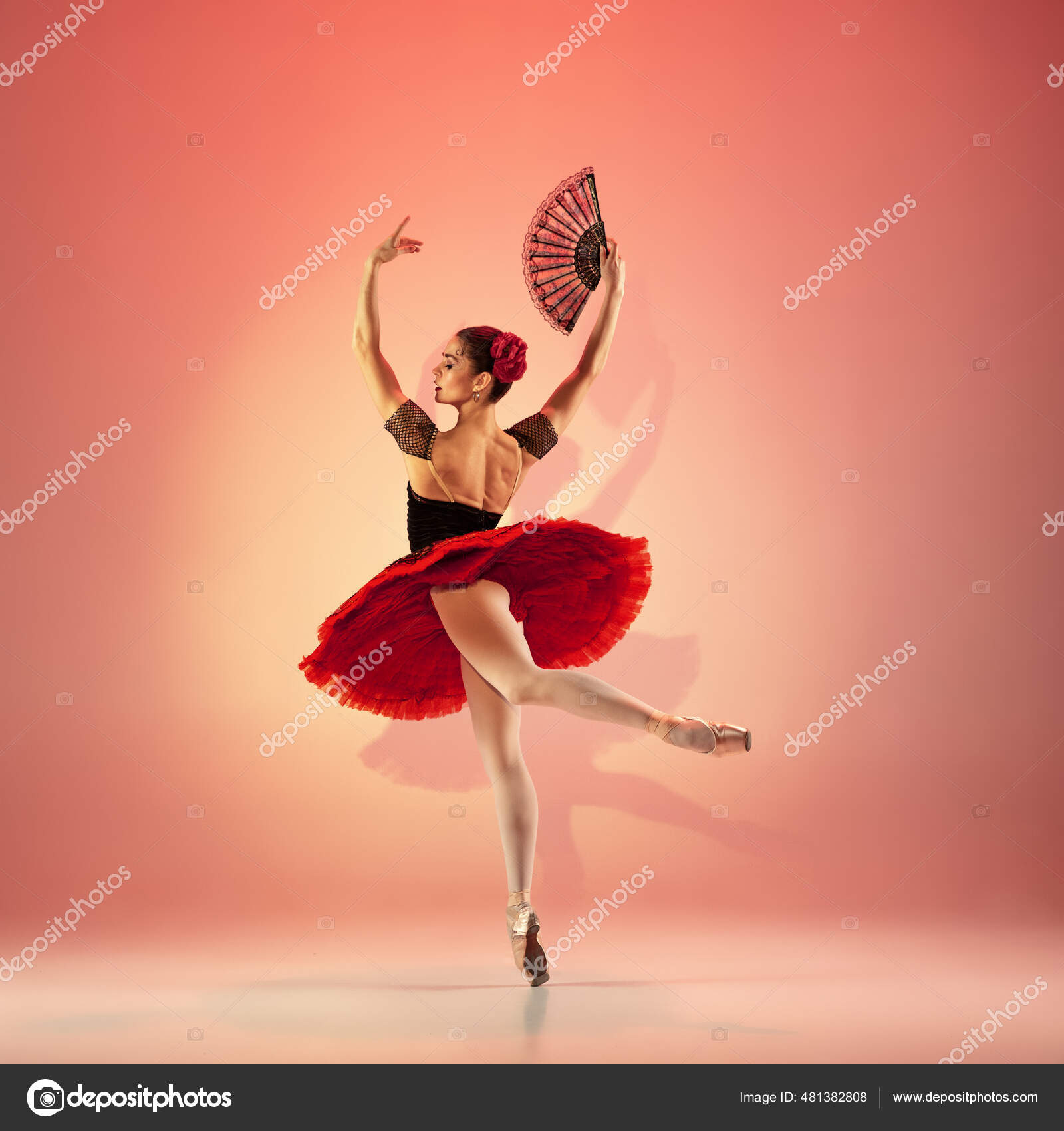 Young and incredibly beautiful ballerina is and dancing at red studio full of light. Stock Photo by ©vova130555@gmail.com 481382808