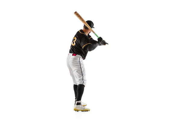 Baseball player, pitcher in a black white sports uniform practicing isolated on a white studio background. — Stock Photo, Image